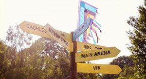 close-up-of-signpost-at-outdoor-music-festival-PX348SH-oyk3nv269nw47hptrirt0mzj9c6uh449wp234009e4